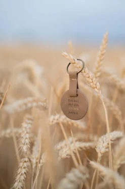 zusss ronde sleutelhanger gouden randje bruin